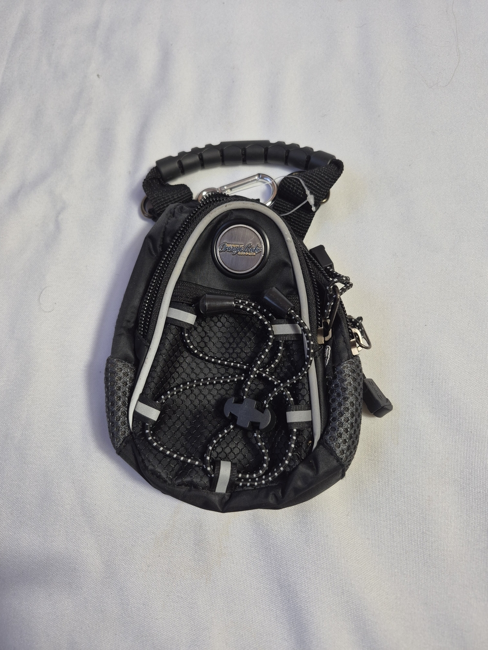 black CMC Design mini day pack mesh front pocket with a bungee cord